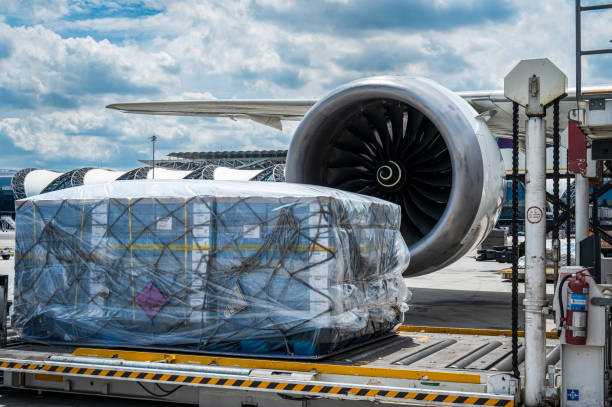 istock Air cargo logistic containers are loading to an airplane. 1683923676