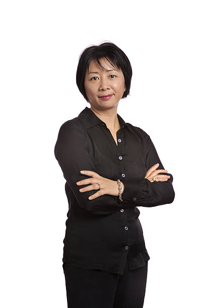 istock Asian executive displaying confidence with arms crossed 168394283
