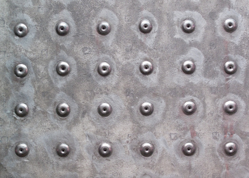 Rivets in metal work make for an interesting background.
