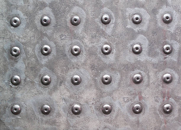 Metal Work Rivets in metal work make for an interesting background. rivet texture stock pictures, royalty-free photos & images