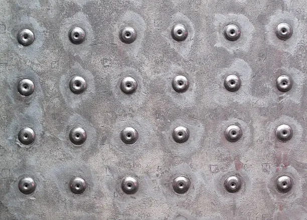 Rivets in metal work make for an interesting background.