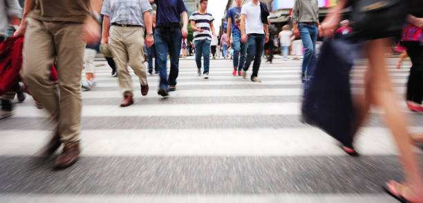 istock Motion blurred pedestrians on zebra crossing 168396476