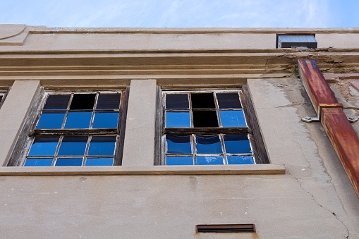 Old building with broken windows in Globe, Arizona.