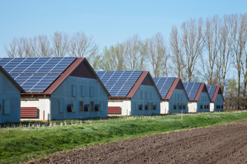 houses or stables with solar panels on the roof