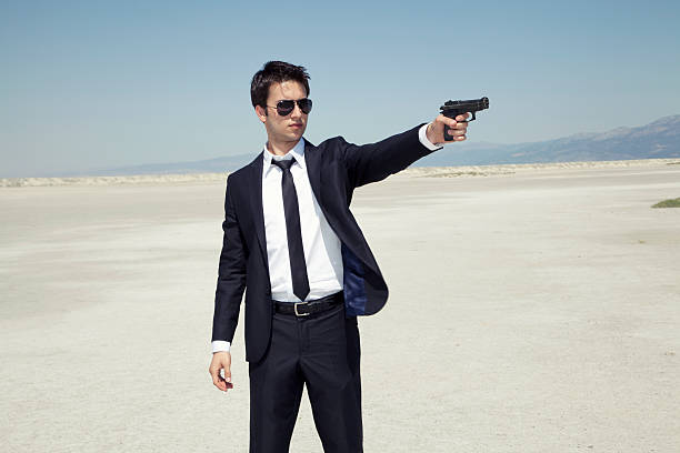 Businessman aiming a handgun