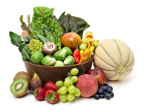 Variety of healthy fruit and vegetables on white background.