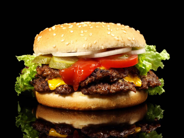 istock Double Hamburger with Cheese isolated on Black Background 1684059136