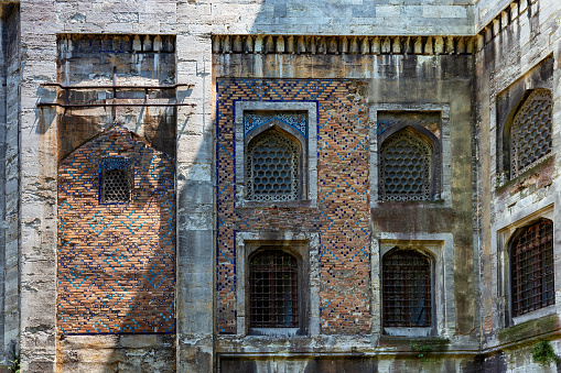 Details of the back facade of the Tiled Kiosk. Is a pavilion set within the outer walls of Topkapi Palace. It was built in 1472. It is located next to Gulhane Park. Istanbul, Turkey.