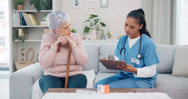 istock Clipboard, senior woman and nurse talking, ask question or writing client info, medical summary or healthcare survey. Checklist, home and retirement caregiver speaking to elderly patient about pills 1684088258