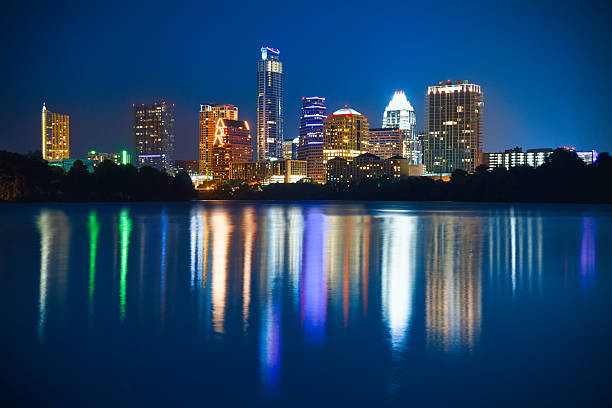 Austin skyline cityscape at night reflected in Ladybird Lake