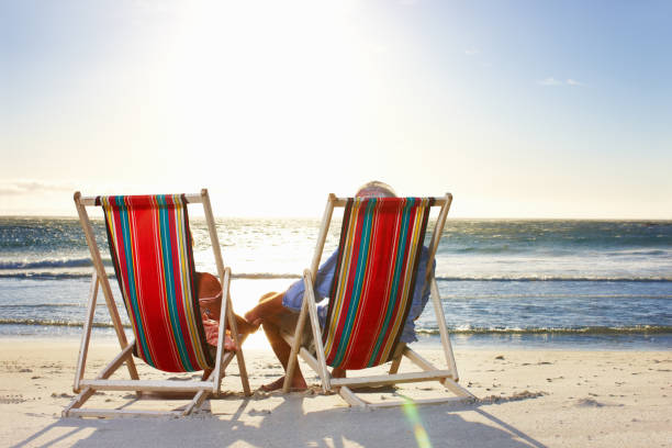 istock Senior couple relaxing at the beach 168410379