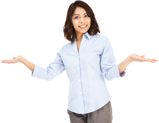 Attractive Young Hispanic Businesswoman Shrugging with Hands Out Photo of an attractive young Hispanic businesswoman in blue button-down shirt, shrugging with hands out; isolated on white. asking yourself stock pictures, royalty-free photos & images