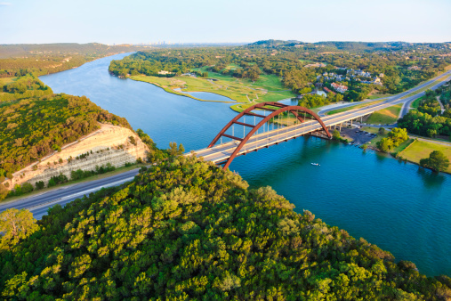Aerial view from helicopter of 360 bridge on Colorado River near Austin Texas.