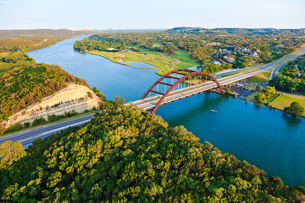Pennybacker 360 bridge, Colorado River, Austin Texas, aerial panorama Aerial view from helicopter of 360 bridge on Colorado River near Austin Texas. colorado river stock pictures, royalty-free photos & images