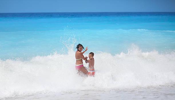 istock Mother and son on the beach 168413408