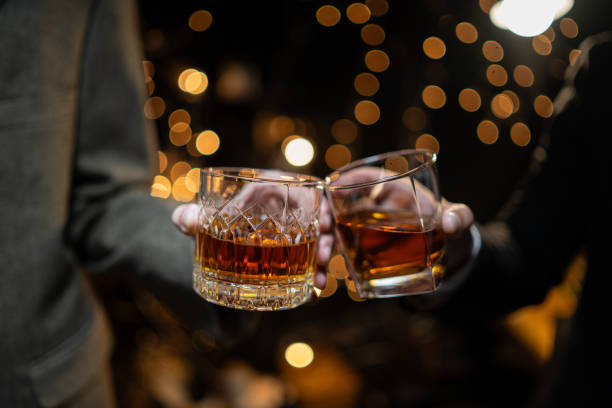Celebrate whiskey Celebrate whiskey on a friendly party in restaurant amber black photography stock pictures, royalty-free photos & images