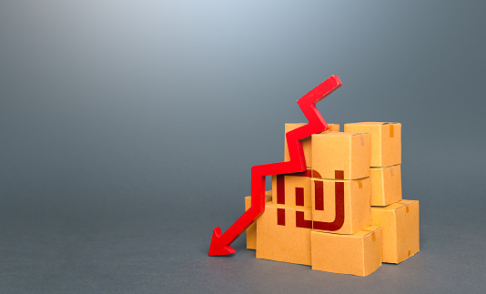 Boxes with israeli shekel symbol and down arrow. Decrease in stocks of products. Worsening trade. Fall in the production of goods. Low consumption. Economic slowdown. Price reduction