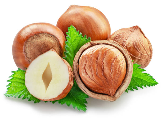 istock Hazelnuts, hazelnut kernel and green leaves on white background. Full depth of field. Clipping path. 1684199412