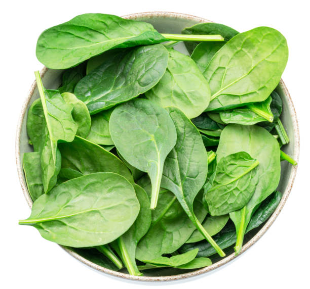 istock Spinach leaves in the bowl isolated on white background. File contains clipping path. 1684199419