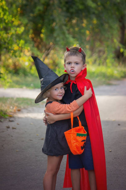 istock Children dressed in costumes for Halloween, festive night. Selective focus 1684210332