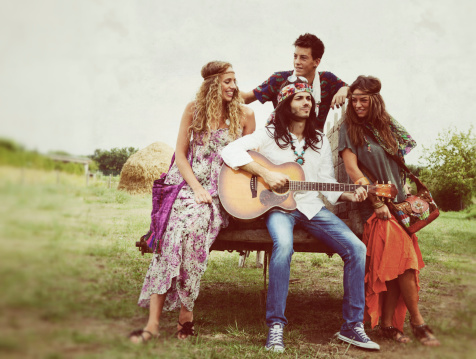 Group of Hippie Singing in Countryside, vintage effect: grain and texture added.