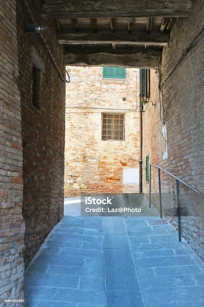 The town of Città della Pieve, Italy. A street between the houses of a medieval village in Umbria region. Ancient Stock Photo