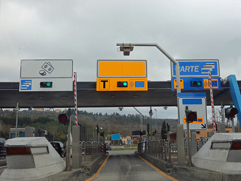 Impruneta, FI, Italy - February 19, 2023: motorway toll booth for toll payment and preferential lane for Telepass Radar