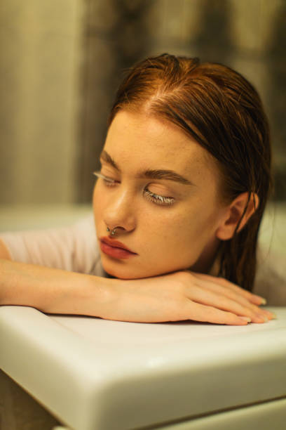 Asian redhead woman in shower.