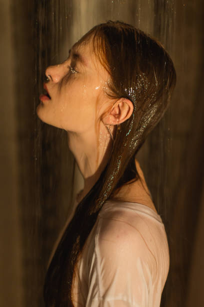 istock Asian redhead woman in shower. Bathroom. 1684276835