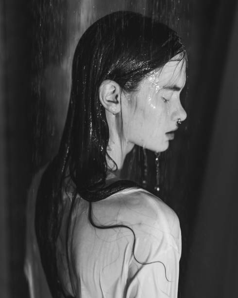 Asian redhead woman in shower. Bathroom.