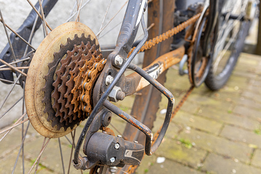 Rusty old bicycle chain on the speed gears of a bicycle.