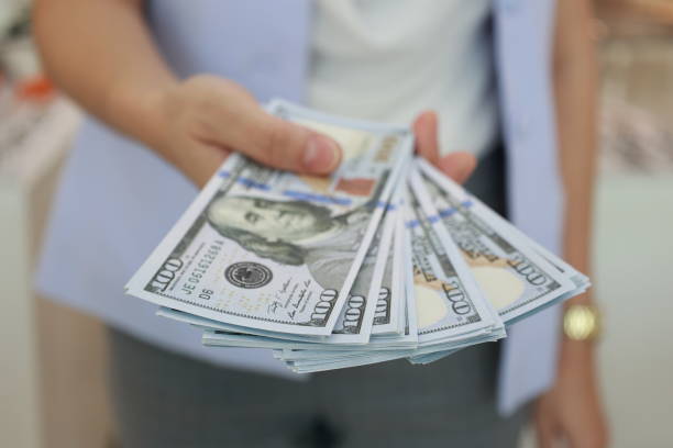 istock Hand holding money dollar bills 1684331113