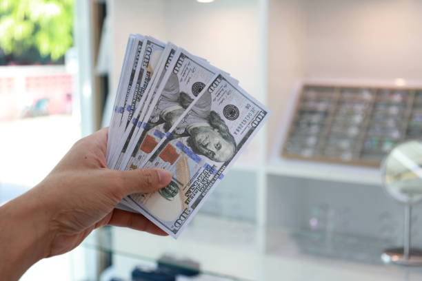 istock Hand holding money dollar bills 1684331669