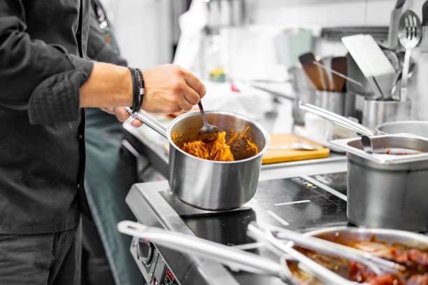 istock Chef cook hand cooking cabbage food at the restaurant kitchen 1684350088