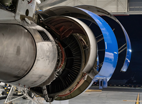 Engine part of aircraft fuselage. Airlines theme. Airplane jet turbine. Air travel background, copy space.