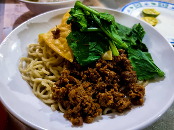 istock chicken noodles with mustard greens on top 1684353434