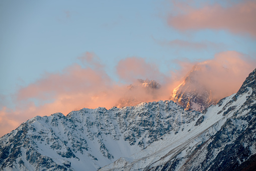 The last light of day falls upon the snowcapped peaks near Mt Cook/Aoraki, on New Zealand's South Island.