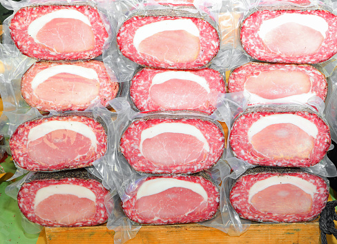 cured meats with bacon and salami vacuum-packed to maintain the food properties integrated for sale in the stalls