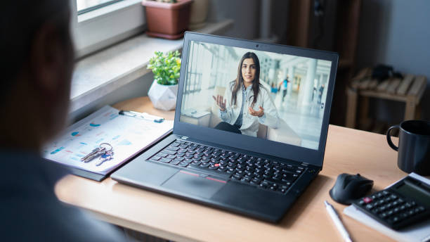 istock Businessman having online conversation with doctor in office 1684373994