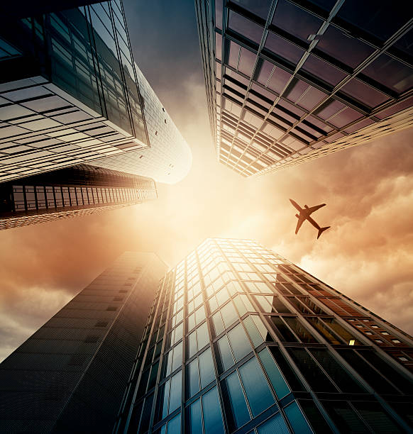 istock Business towers with a airplane silhouette 168437518