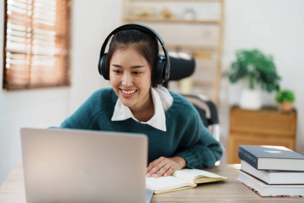 istock Studying online, beautiful Asian female student or student studying online at home 1684382239