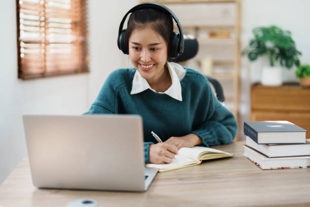 istock Studying online, beautiful Asian female student or student studying online at home 1684383269
