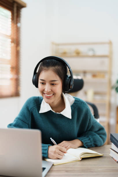istock Studying online, beautiful Asian female student or student studying online at home 1684383671