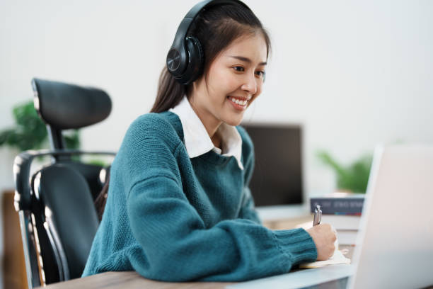 istock Studying online, beautiful Asian female student or student studying online at home 1684386035