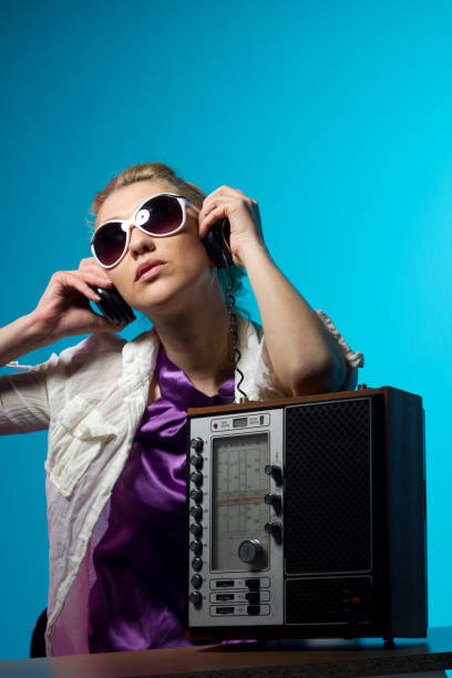 istock Young woman and retro radio 168438861