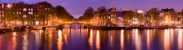 istock Illuminated Amsterdam Canal at dusk. 168439979