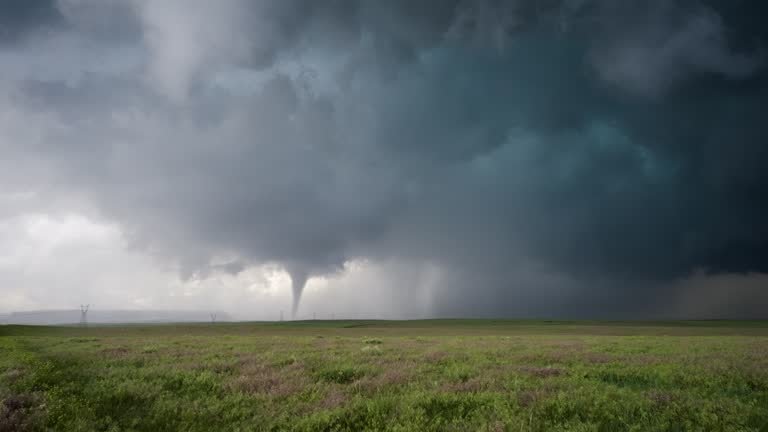 Mesmerizing Tornado Touches Down Near Power Lines On The Open Plains