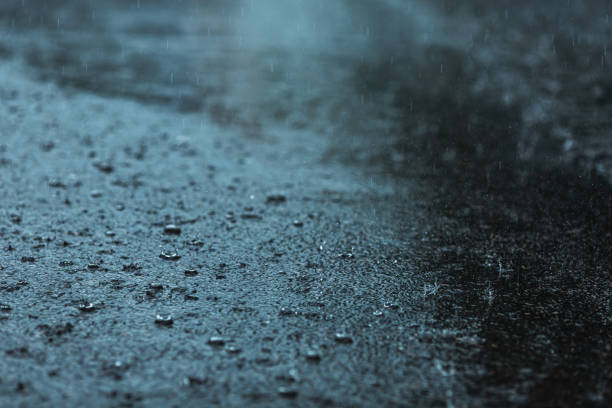 istock Raindrops on asphalt. Weather. Background. Rain 1684421264