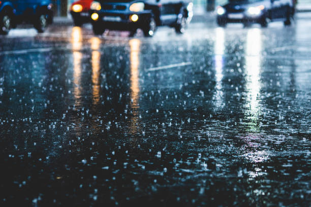 istock Wet asphalt. Raindrops on road. Weather. Background. Rain 1684424003