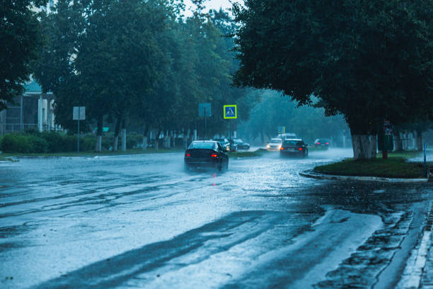 istock Wet asphalt. Raindrops on road. Weather. Background. Rain 1684424557